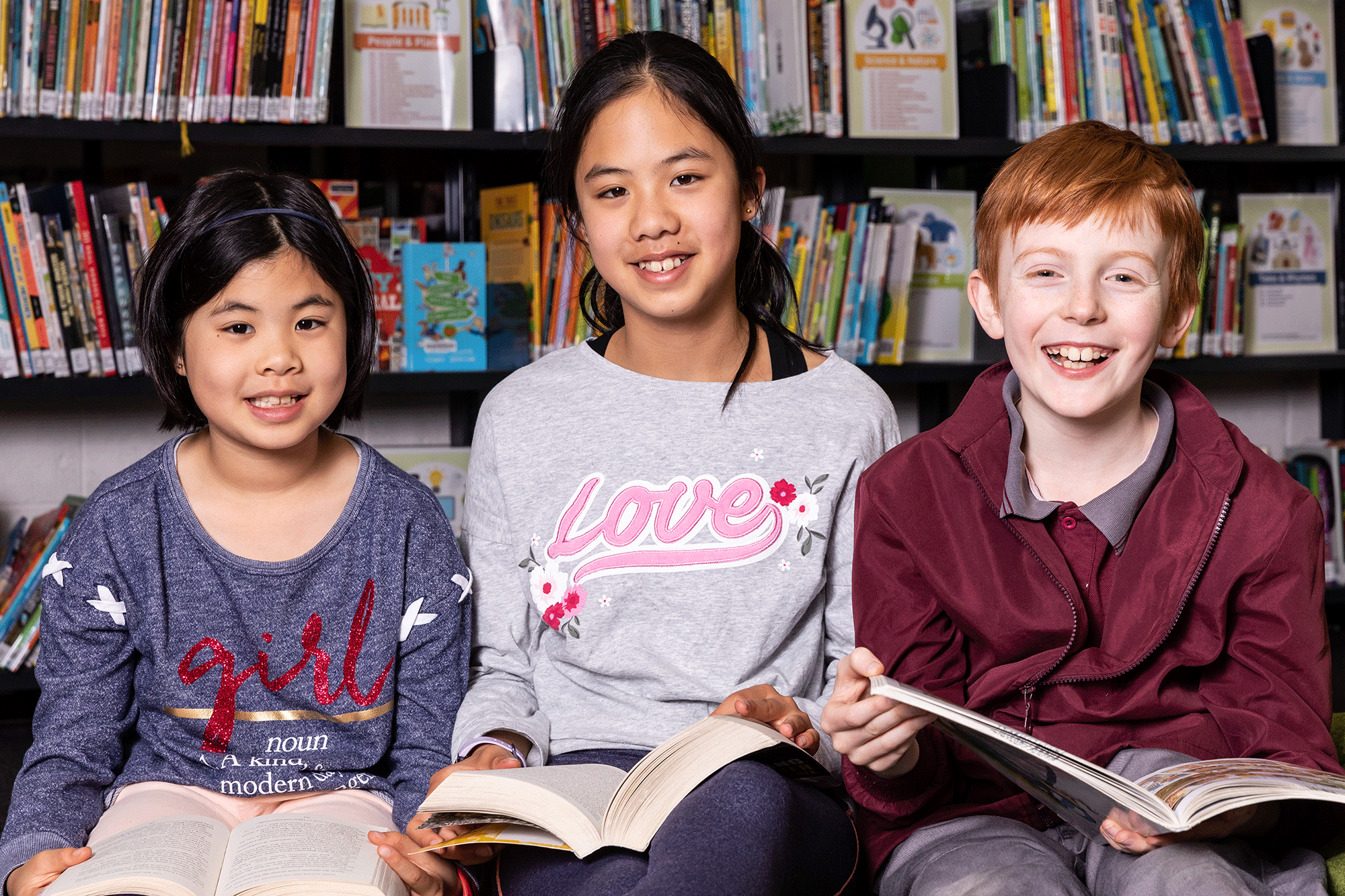 Image of three children participating in the summer reading program.