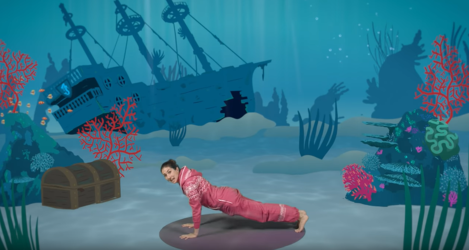 A woman doing yoga in an under the sea setting