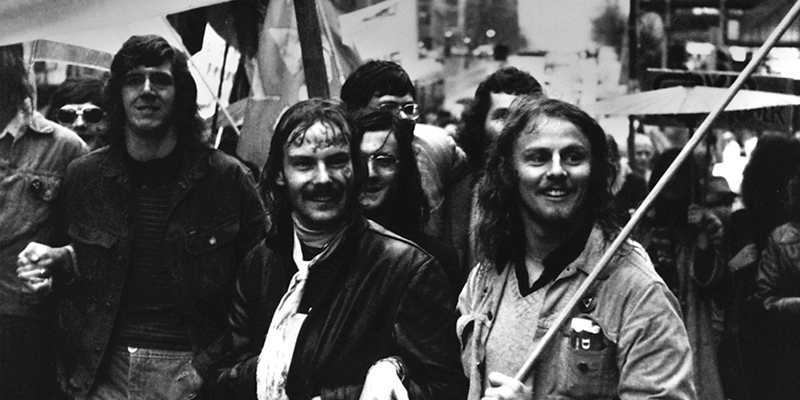 Black and white image of men in a protest