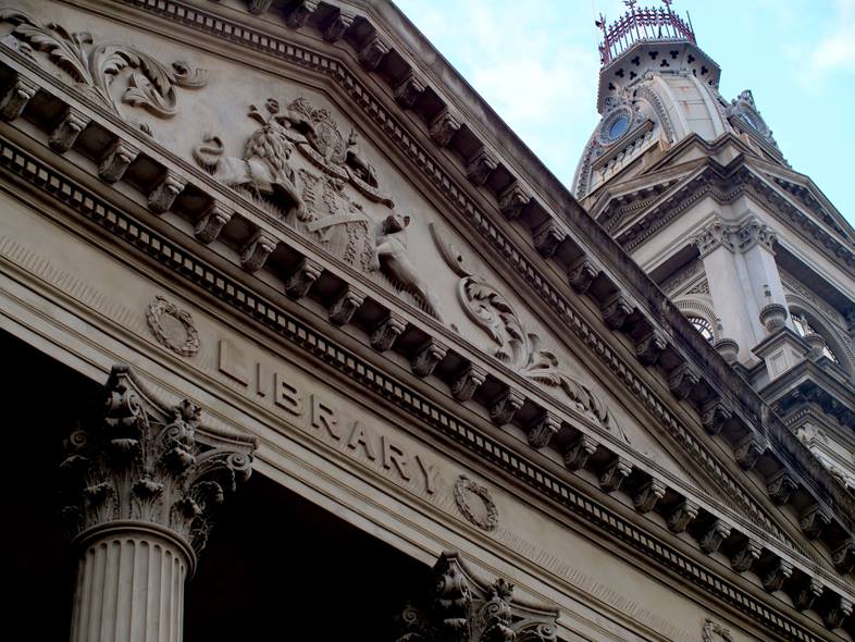 Looking up at the word library on the Fitzroy Town Hall